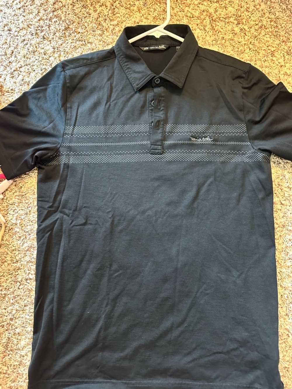 Travis Mathew Black Short-Sleeve Polo Shirt with Subtle Stripe Detail